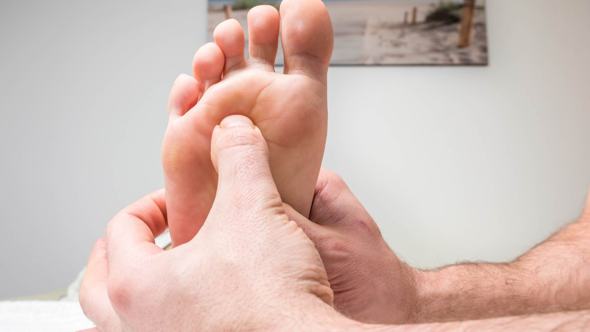 man getting foot treatment for ankle sprain
