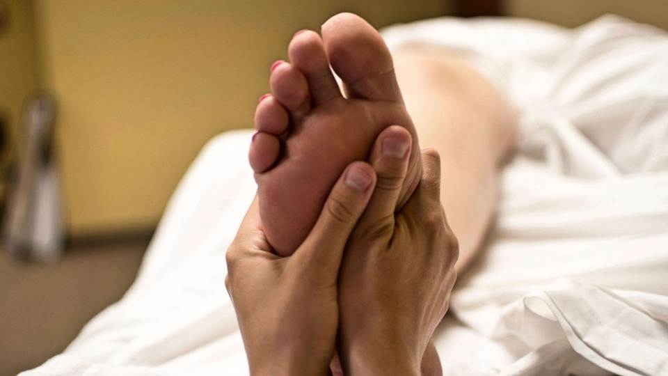 woman getting physio for heel pain