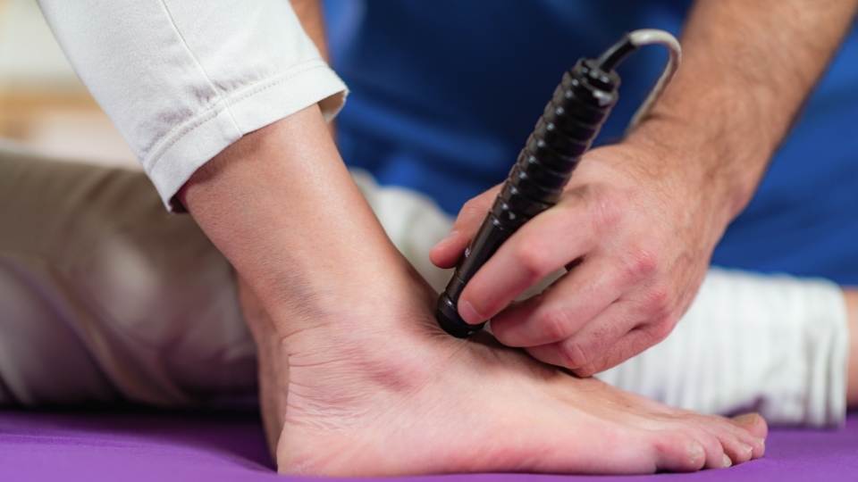 man getting laser therapy for heel pain