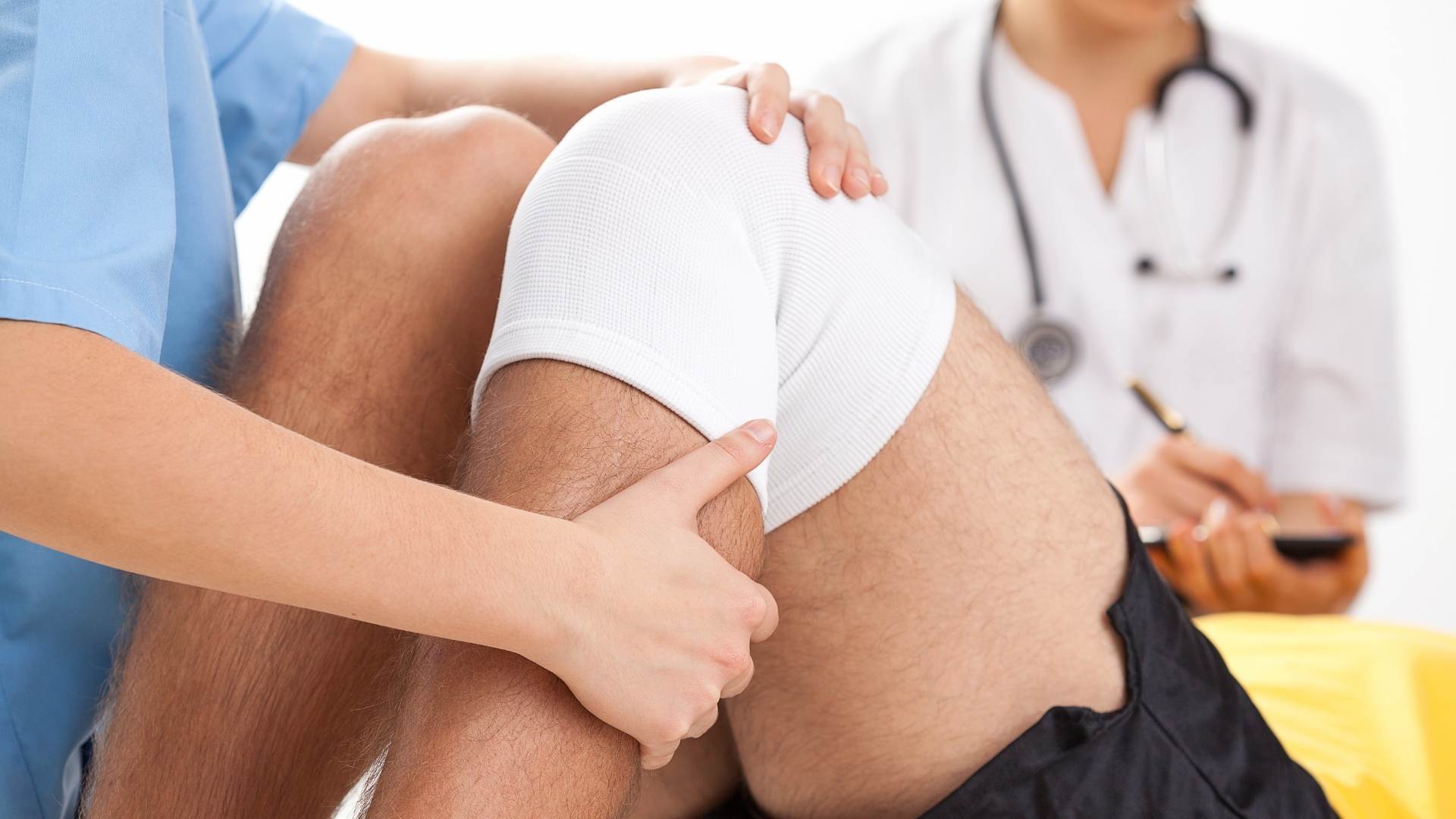 man with knee bandage