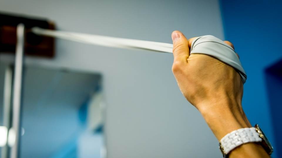 man doing physiotherapy for cubital tunnel syndrome